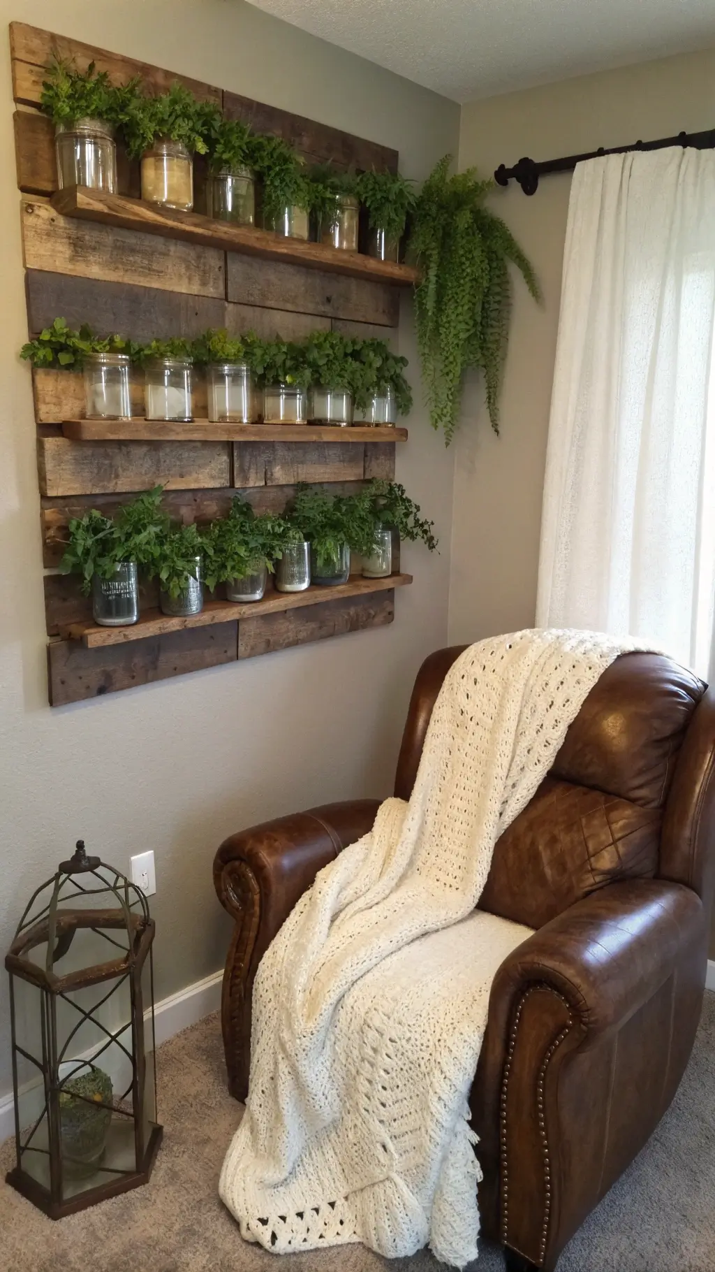 Reading nook with a DIY mason jar wall garden on barnwood boards. Three rows of jars hold trailing ivy and ferns. A weathered leather armchair with an ivory chunky knit throw sits below. Soft, indirect lighting enhances the cozy ambiance.