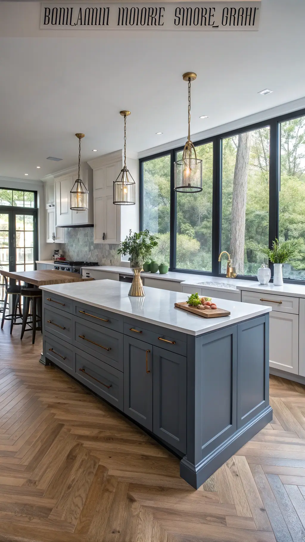Modern kitchen with blue-gray shaker cabinets, white quartz countertops, oak herringbone floors, and soft morning light through tall windows.