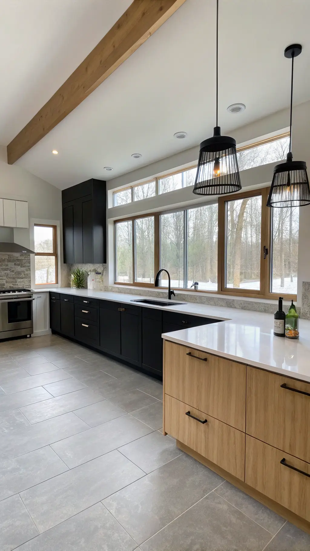 Modern minimalist kitchen with matte black and light oak cabinets, white quartz counters, geometric pendant lights, and porcelain tile flooring in soft diffused daylight.